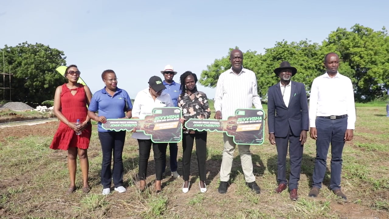 kcb-revvvisha-campaign-rewards-kitale-businesswoman-with-land-prize Image
