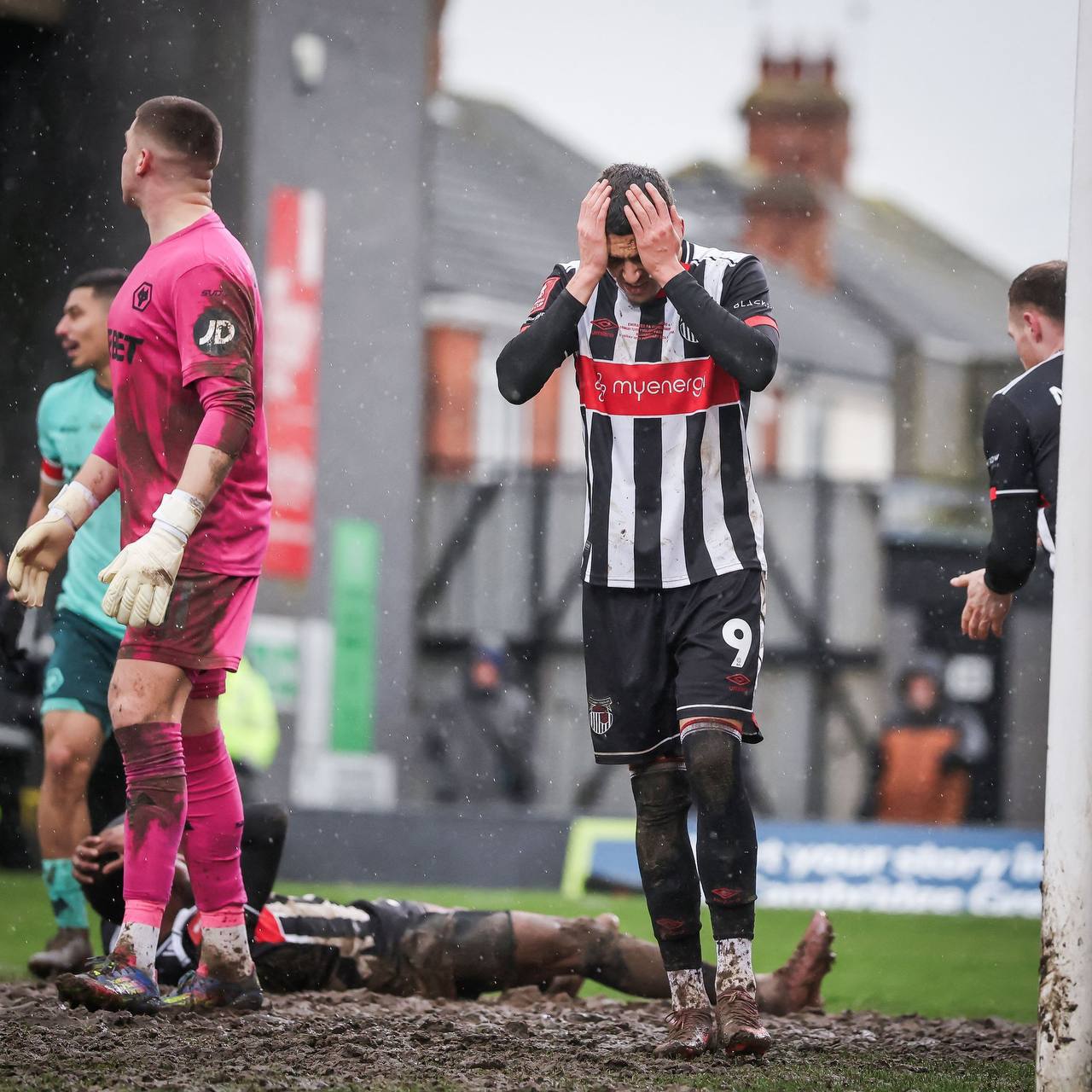 fa-cup-drama-wolves-prevail-in-mudsoaked-battle-at-blundell-park Image